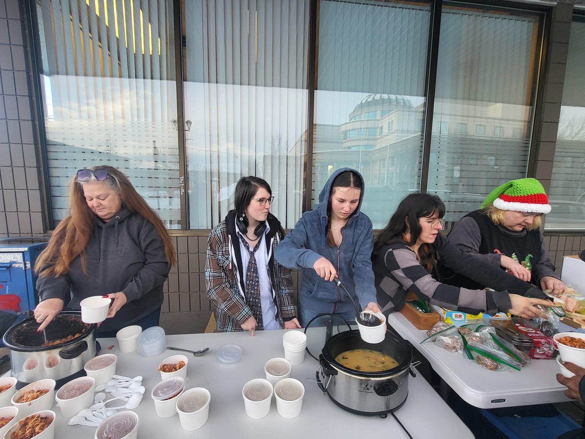 Volunteers serving food
